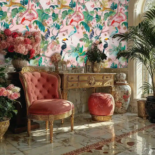 An exotic animal wallpaper in pink and green, featuring tigers and toucans, in a luxurious room with a gold-framed pink velvet armchair.