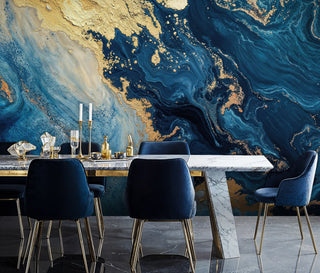 Abstract navy gold marble wall mural with teal swirls in a glam dining room with marble table and velvet chairs