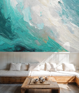 Abstract ocean wave wall mural with turquoise and cream brushstrokes, in scandinavian living room with white sofa