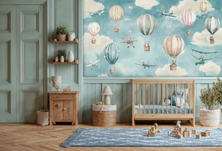 Adventure aviation wallpaper with teddy bears in balloons and classic planes shown in a sage green nursery with wooden crib and woven baskets