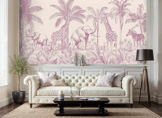 African wildlife wallpaper in soft pink tones with elephants and palm trees, displayed in classic living room with tufted cream sofa