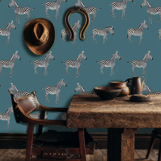African zebra pattern wallpaper featuring detailed wildlife motifs, shown in rustic dining space with leather chair