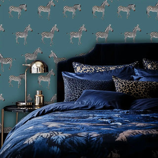 African zebra wallpaper with detailed wildlife design, styled in luxurious bedroom with navy blue bedding