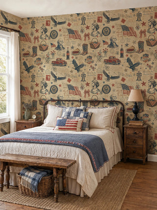 Americana collage wallpaper with eagles and gingham baskets on parchment beige, behind an iron bed with flag pillow