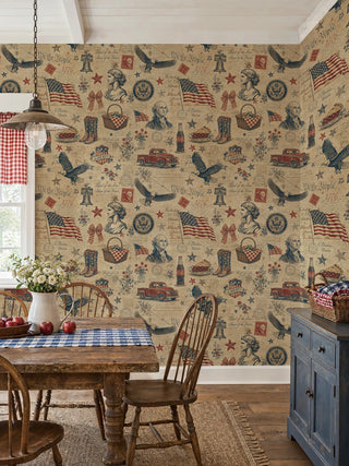 Americana collage wallpaper with red trucks, boots, and wildflowers on aged beige, in a country dining room with gingham