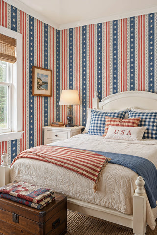 Americana striped wallpaper with white stars on blue bands in a cottage bedroom with vintage trunk