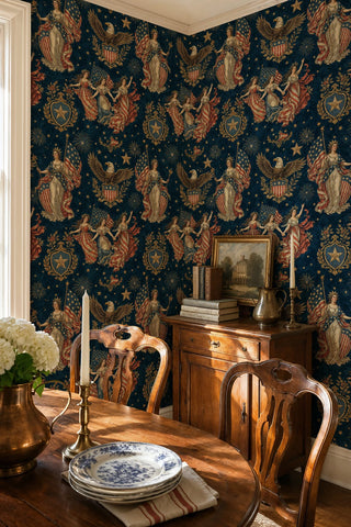 Americana wallpaper featuring flags, golden crests, and allegorical figures on deep blue, in a dining room with antique sideboard