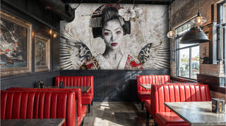 Angelic geisha wall mural with wings and cherry blossoms in restaurant with red leather booths