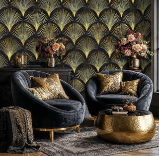 Art Deco fan wallpaper with golden scalloped motifs on black, displayed in elegant living room with velvet armchairs