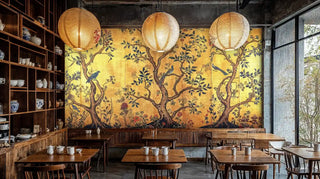 Asian botanical wallpaper with birds and branches in modern cafe setting with wooden tables and paper lanterns