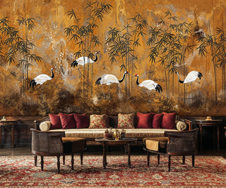 Asian crane wall mural featuring elegant birds and bamboo, displayed in classic room with burgundy sofa and pillows