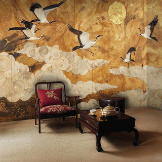 Asian crane wallpaper featuring golden background and white clouds in traditional room with red chair