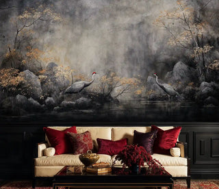 Asian crane wallpaper with autumn mist and rocks, displayed in elegant living room with red velvet cushions