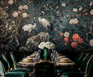 Asian crane wallpaper with coral flowers in sophisticated dining room with emerald velvet chairs