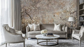 Asian-inspired wall mural featuring blossoms and birds in elegant living room with marble coffee table and gray furniture