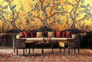 Asian-inspired Wall Mural with birds and trees on golden background in formal living room with burgundy sofa