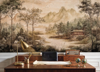 Asian landscape wallpaper with cranes and mountains displayed in home office with brass desk lamp