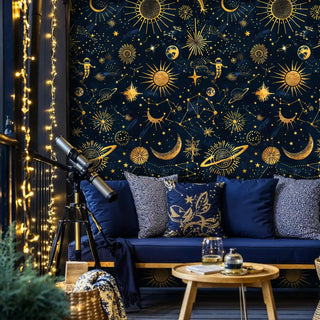 Astronomical wallpaper with sun and moon motifs displayed in sophisticated living room with blue sofa and telescope