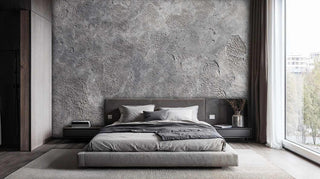 Authentic concrete surface wall mural in neutral grey tones with organic textures, shown in modern minimalist bedroom
