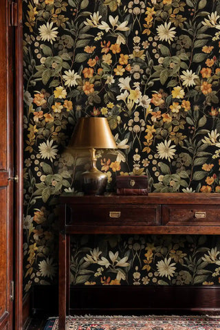Autumn wildflower wallpaper featuring daisies and orange blooms, displayed in traditional study with wooden console