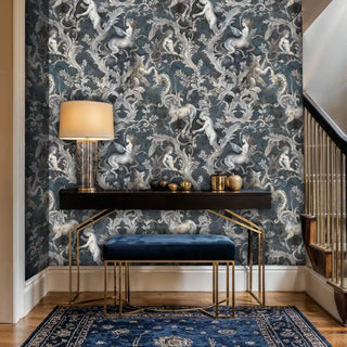 Baroque mythology wallpaper with unicorns and cherubs, shown in elegant entryway with gold console table and blue bench