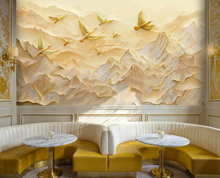 Bas-relief golden mountain wall mural with birds in flight, shown in an elegant cafe with marble tables