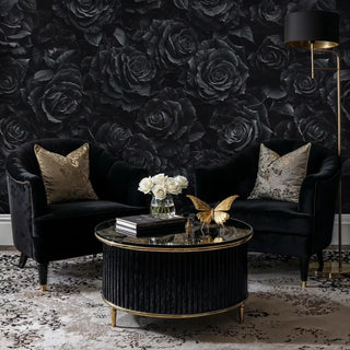 Black floral wall mural featuring roses in elegant sitting area with velvet chairs and round coffee table