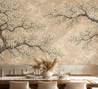 Blooming tree wall mural in warm beige tones with white flowers, shown in dining room with pampas grass centerpiece