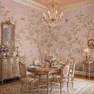 Blush floral chinoiserie wall mural featuring birds on branches, displayed in a formal dining room with crystal chandelier