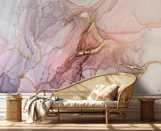 blush marble wallpaper with gold veining behind curved daybed with woven texture