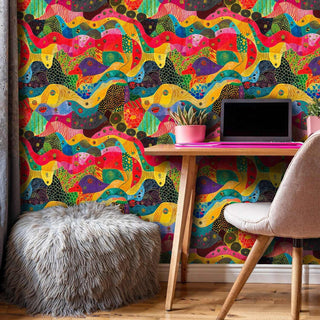 bold abstract flowing wallpaper with colorful undulating bands in modern home office with wooden desk