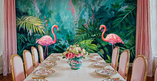 Bold tropical flamingo wall mural in pink and teal tones, displayed in elegant dining room with golden chairs