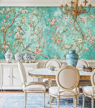 Botanical bird wall mural in turquoise with pink flowers displayed in formal dining room with blue and white porcelain
