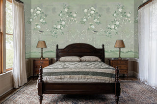 Botanical bird wallpaper in sage and white shown in traditional bedroom with wooden four-poster bed
