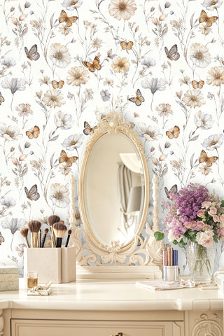 Botanical butterfly removable wallpaper in neutral tones, shown in vanity area with ornate gold mirror