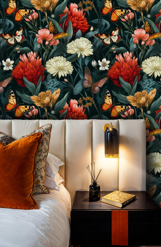 Botanical butterfly wallpaper with coral dahlias and monarch butterflies in modern bedroom with cream headboard