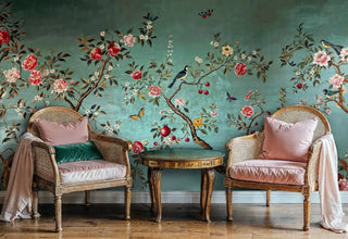 Botanical chinoiserie wallpaper featuring birds and flowers, displayed with vintage cane chairs and round table
