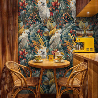 Botanical cockatoo wallpaper with teal background shown in modern kitchen with yellow espresso machine