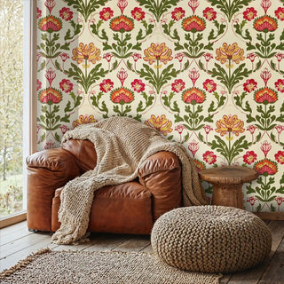 Botanical damask wallpaper featuring ornate florals in cozy living room with leather armchair and knit throws
