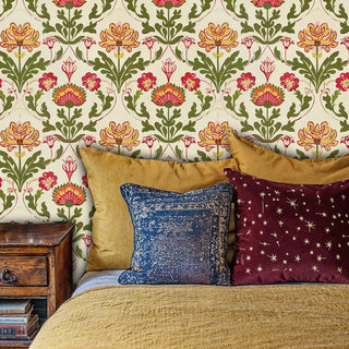 Botanical damask wallpaper with coral and yellow flowers in cozy bedroom with colorful throw pillows