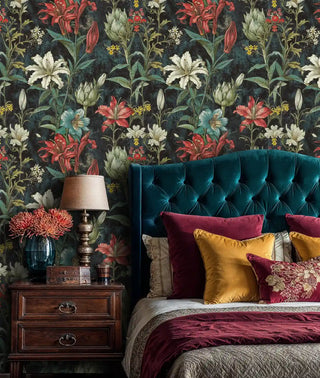 Botanical floral wallpaper with lilies in rich bedroom setting with tufted teal headboard