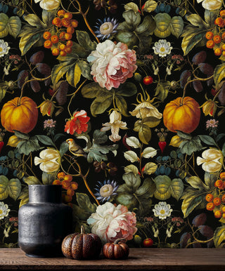 Botanical harvest wallpaper with vibrant peonies, golden pumpkins on black, displayed in rustic kitchen with ceramic vases