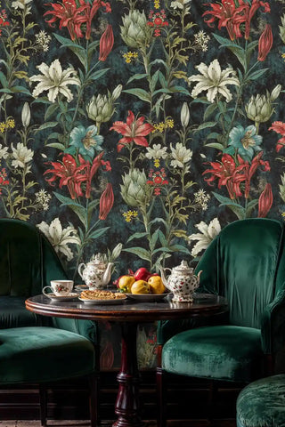 Botanical lily wallpaper featuring coral and white flowers in elegant dining room with green velvet chairs