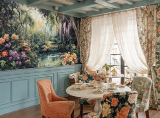 Botanical paradise wall mural with purple wisteria and orange flowers in charming breakfast nook with round table