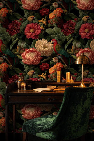 Botanical parrot wallpaper with rich blooms and tropical birds, displayed in home office with brass lamp