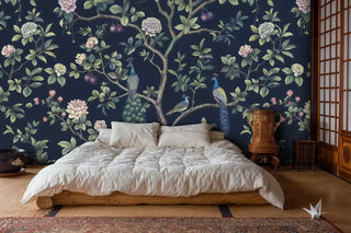 Botanical peacock wallpaper in minimalist bedroom with low platform bed and tatami mats