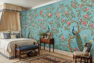 Botanical peacock wallpaper with turquoise background, styled in classic bedroom with antique nightstand