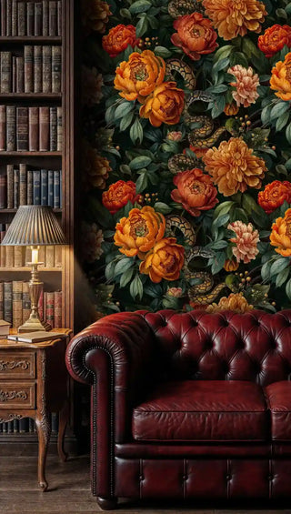 Botanical serpent wallpaper in classic library setting with red leather chesterfield sofa