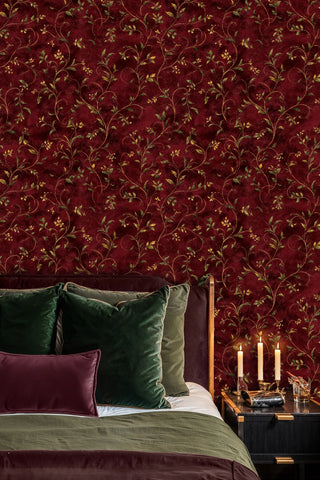 Botanical vine wallpaper featuring delicate leafy vines, displayed in elegant bedroom with green velvet pillows