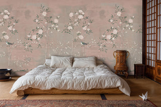Botanical wall mural featuring delicate birds among flowering branches, shown in Japanese-style bedroom with wooden platform bed